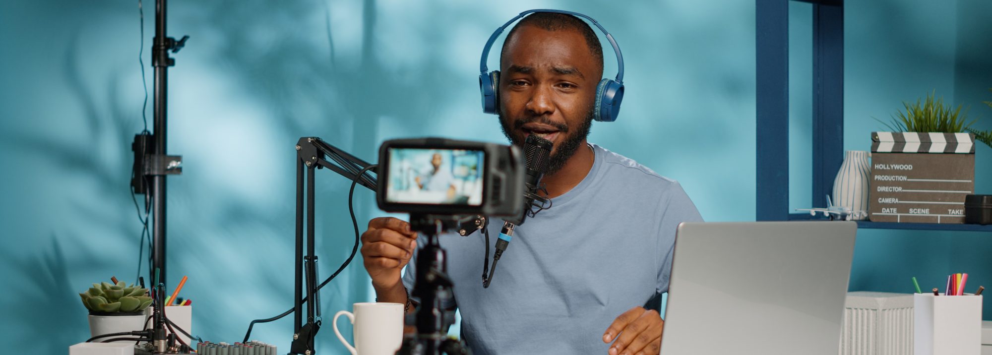 Man sitting in front of camera and microphone