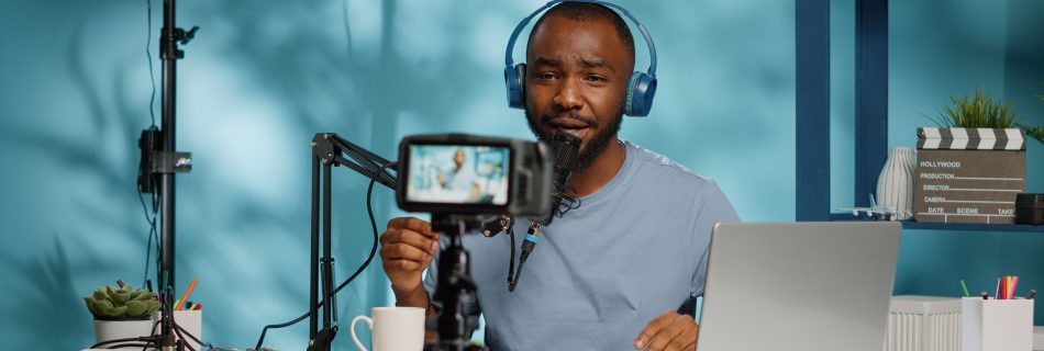 Man sitting in front of camera and microphone